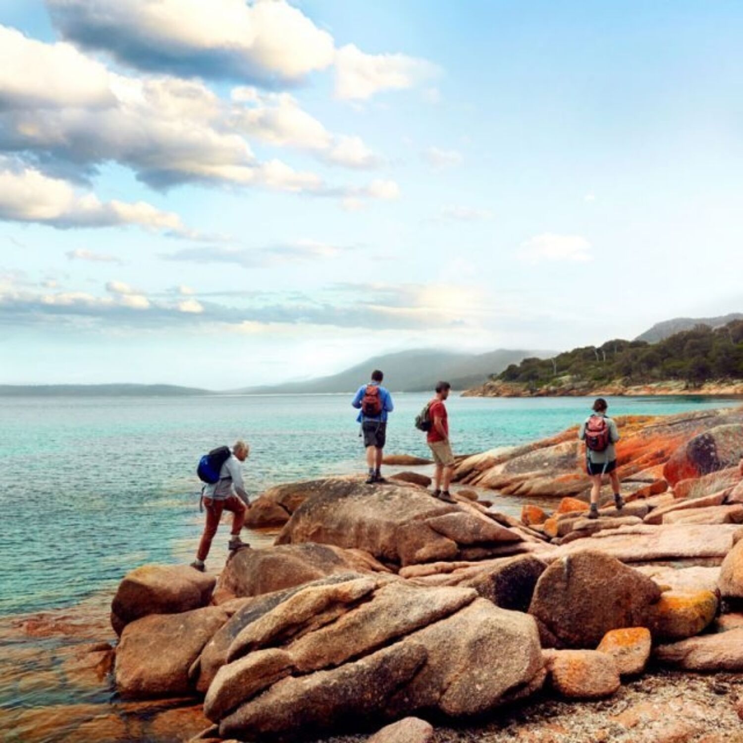 Freycinet experience walk tasmania great walks of australia walking on rocks 960x640